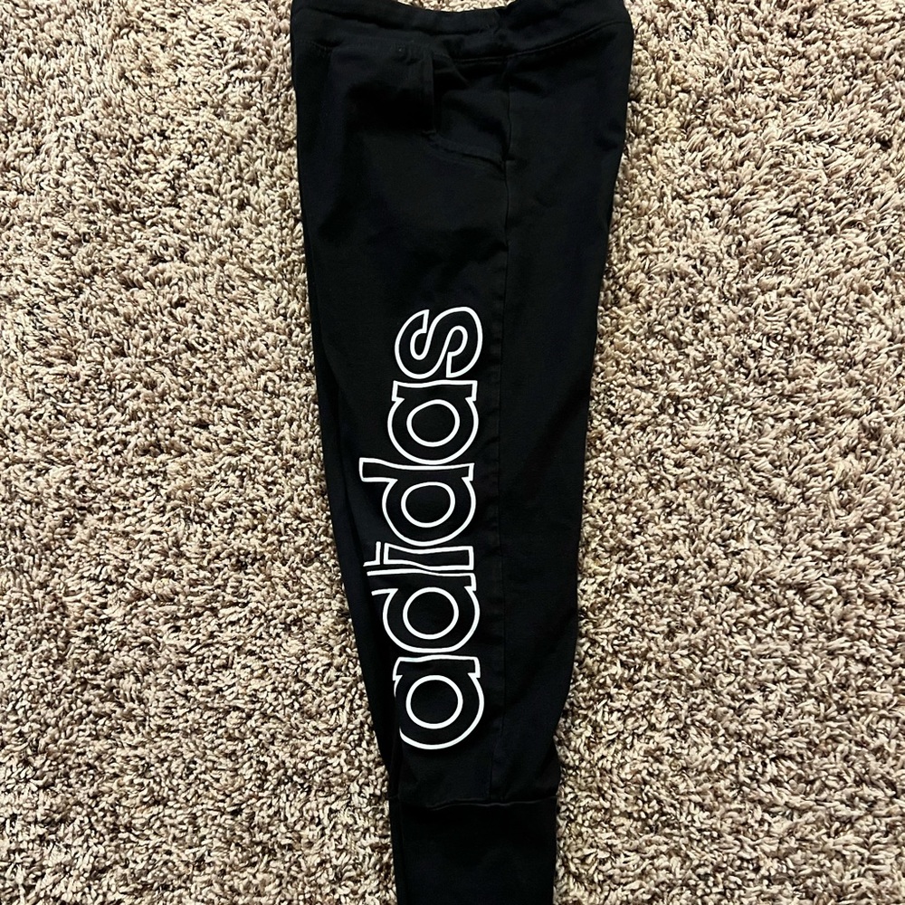 Girls black Nike joggers.